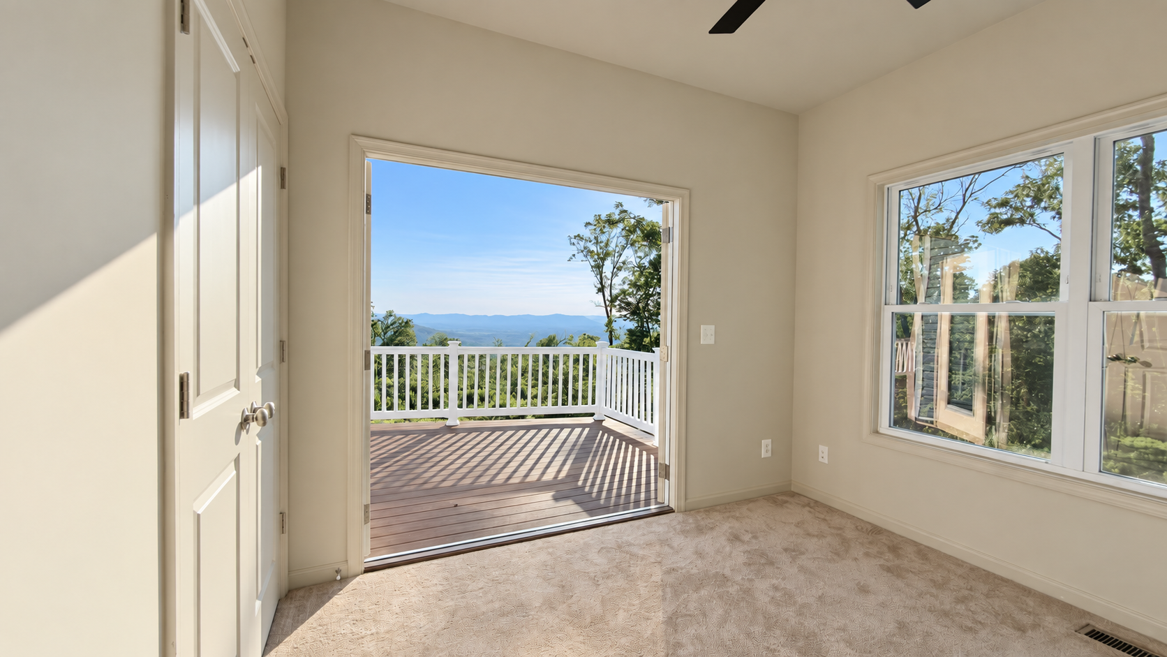 Grace Chalet carpeted bedroom with deck view