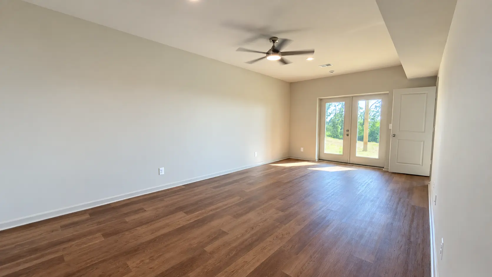 Grace Chalet bedroom with french doors to the yard