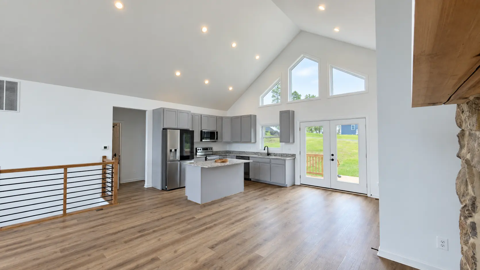 Grace Chalet open plan kitchen under vaulted ceilings